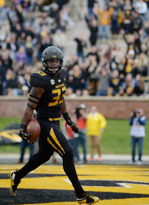 Larry Rountree looks at the crowd after scoring a touchdown (copy)